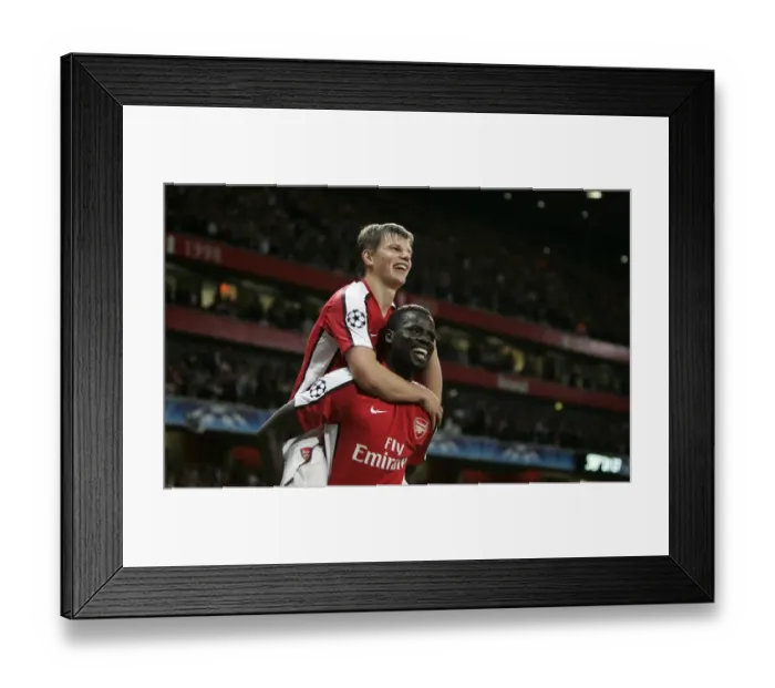 Framed Print : Arshavin and Eboue: Arsenal's Unstoppable Duo Celebrates 2-0 Over Olympiacos in Champions League