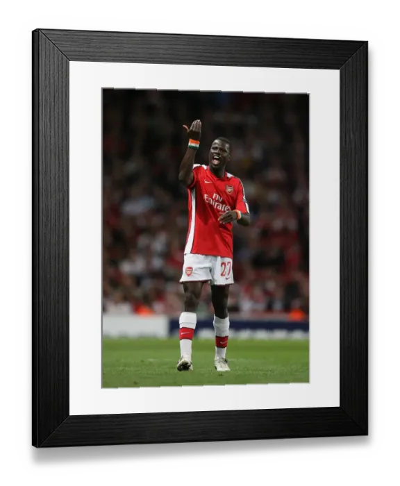 Framed Print : Arsenal's Emmanuel Eboue Scores in UEFA Champions League: Arsenal 2-0 Olympiacos