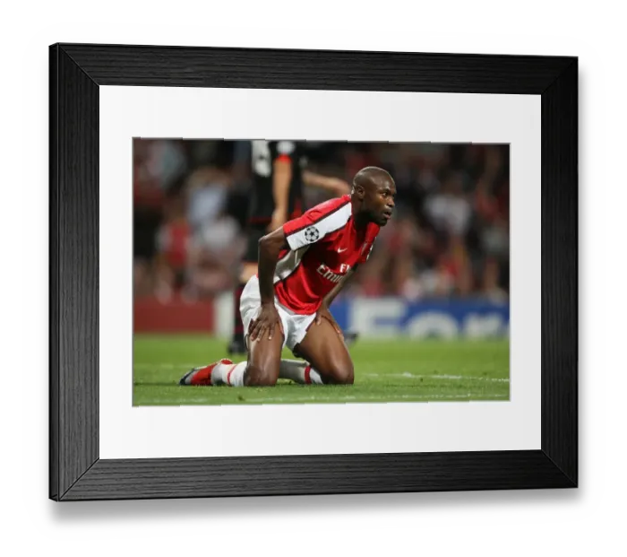 Framed Print : William Gallas Leads Arsenal to 2-0 Victory over Olympiacos in Champions League Group H