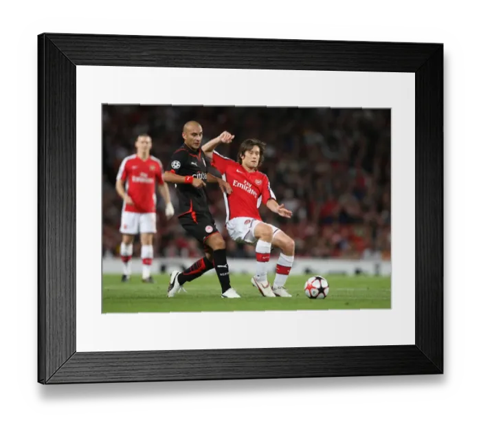 Framed Print : Arsenal's Rosicky and Ledesma Clash in Group H Showdown: Arsenal 2-0 Olympiacos, UEFA Champions League, Emirates Stadium, 2009 Framed Print : Arsenal's Rosicky and Ledesma Clash in Group H Showdown: Arsenal 2-0 Olympiacos, UEFA Champions League, Emirates Stadium, 2009