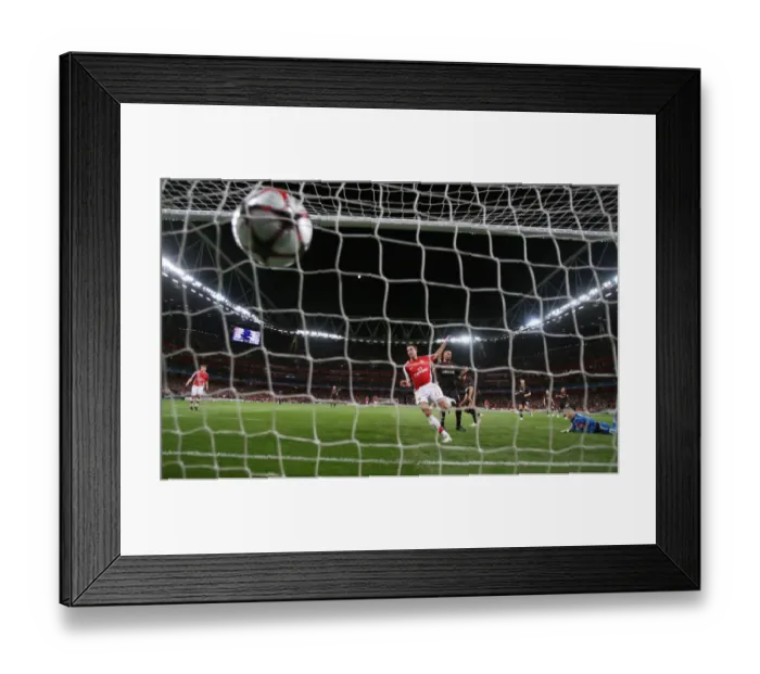 Framed Print : Robin van Persie shoots past Olypmiacos goalkeeper Framed Print : Robin van Persie shoots past Olypmiacos goalkeeper