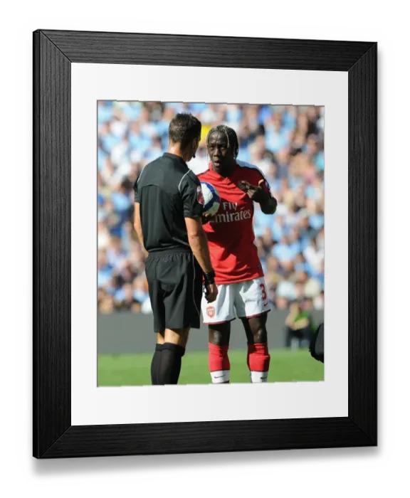 Framed Print : Bacary Sagna (Arsenal) talks with referee Mark Clattenburg
