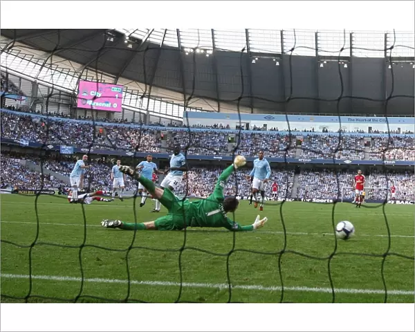 Robin van Persie shoots past Man City goalkeeper Shay