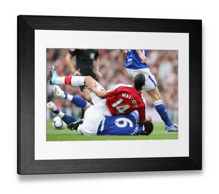 Framed Print : Theo Walcott (Arsenal) is tackled by Liam Ridgewell (Birmingham)