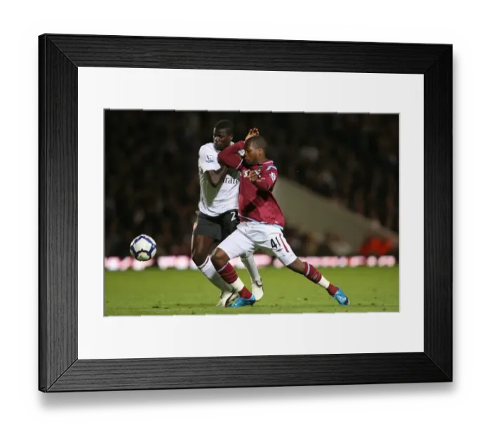 Framed Print : Emmanuel Eboue (Arsenal) Zavon Hines (West Ham) Framed Print : Emmanuel Eboue (Arsenal) Zavon Hines (West Ham)