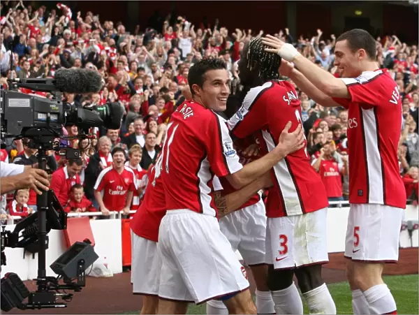 Celebrating Glory: Fabregas, Van Persie, Eduardo, Vermaelen, and Sagna Rejoice in Arsenal's 3-0 Victory over Tottenham