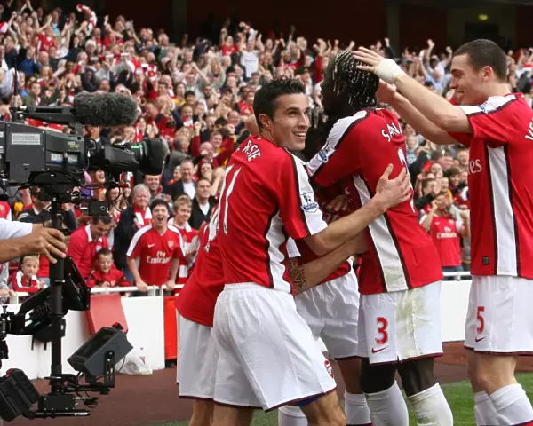 Celebrating Glory: Fabregas, Van Persie, Eduardo, Vermaelen, and Sagna Rejoice in Arsenal's 3-0 Victory over Tottenham