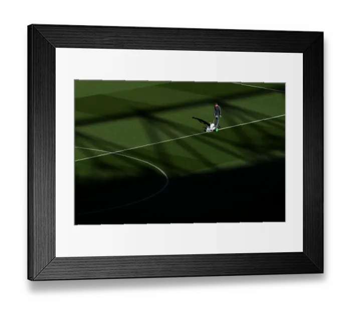 Framed Print : Arsenal's Groundsman Readies the Pitch for Arsenal v Leicester City (2018-19) Framed Print : Arsenal's Groundsman Readies the Pitch for Arsenal v Leicester City (2018-19)