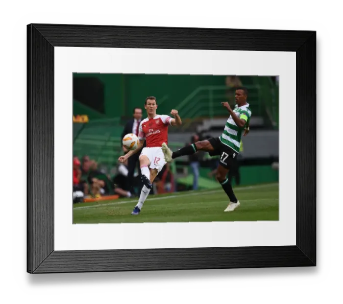 Framed Print : Stephan Lichtsteiner vs. Nani: Battle for Ball Possession in Arsenal's Europa League Clash with Sporting Lisbon Framed Print : Stephan Lichtsteiner vs. Nani: Battle for Ball Possession in Arsenal's Europa League Clash with Sporting Lisbon
