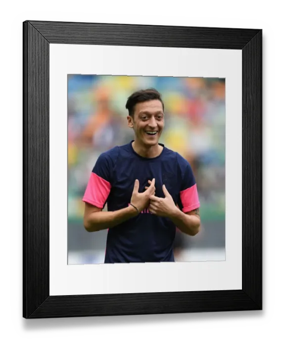 Framed Print : Mesut Ozil: Arsenal's Star Prepares for Europa League Battle against Sporting Lisbon