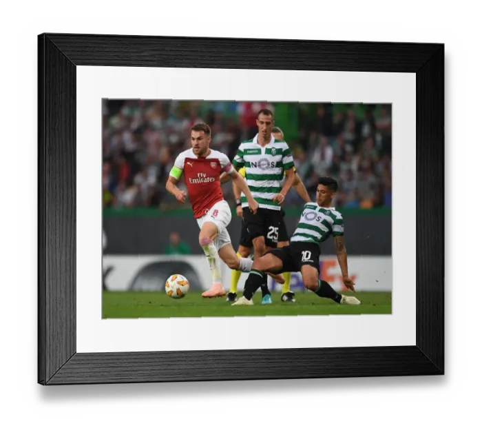 Framed Print : Aaron Ramsey vs. Fredy Montero: Clash in the UEFA Europa League between Sporting CP and Arsenal Framed Print : Aaron Ramsey vs. Fredy Montero: Clash in the UEFA Europa League between Sporting CP and Arsenal