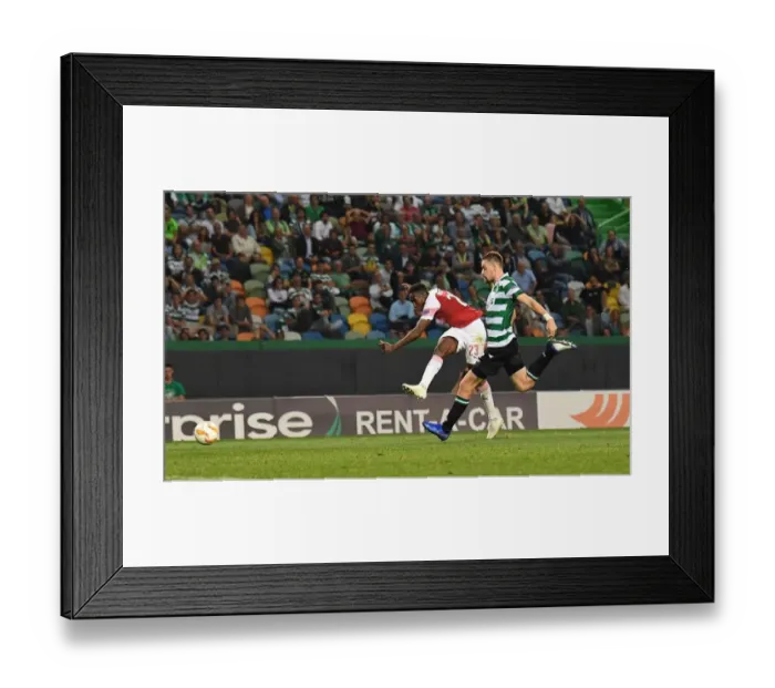 Framed Print : Danny Welbeck Scores the Winner: Arsenal Triumphs Over Sporting CP in Europa League
