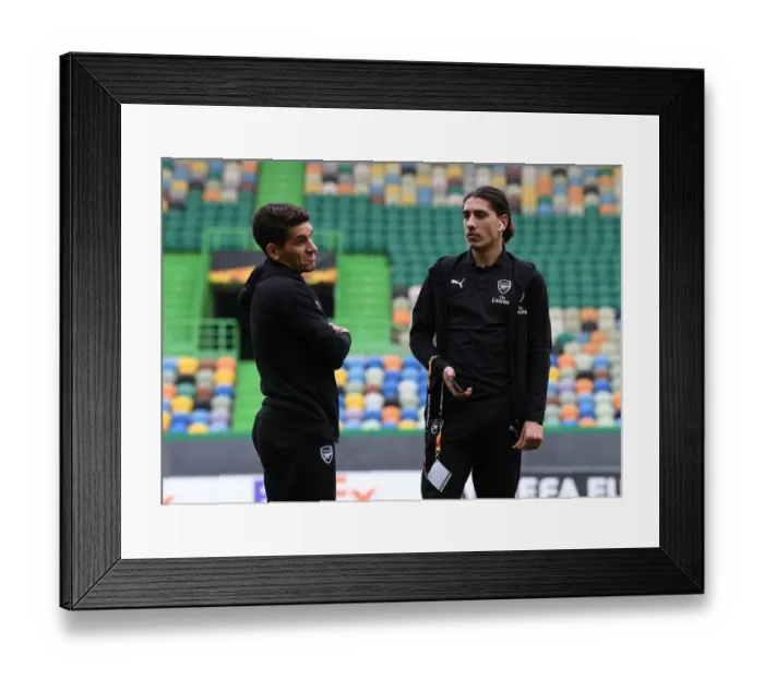 Framed Print : Arsenal's Torreira and Bellerin Scout Sporting Lisbon's Estadio Jose Alvalade Pitch Ahead of Europa League Clash Framed Print : Arsenal's Torreira and Bellerin Scout Sporting Lisbon's Estadio Jose Alvalade Pitch Ahead of Europa League Clash