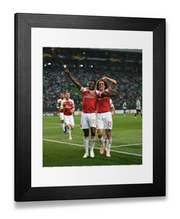 Framed Print : Welbeck and Guendouzi Celebrate Arsenal's Goal Against Sporting CP in Europa League Framed Print : Welbeck and Guendouzi Celebrate Arsenal's Goal Against Sporting CP in Europa League
