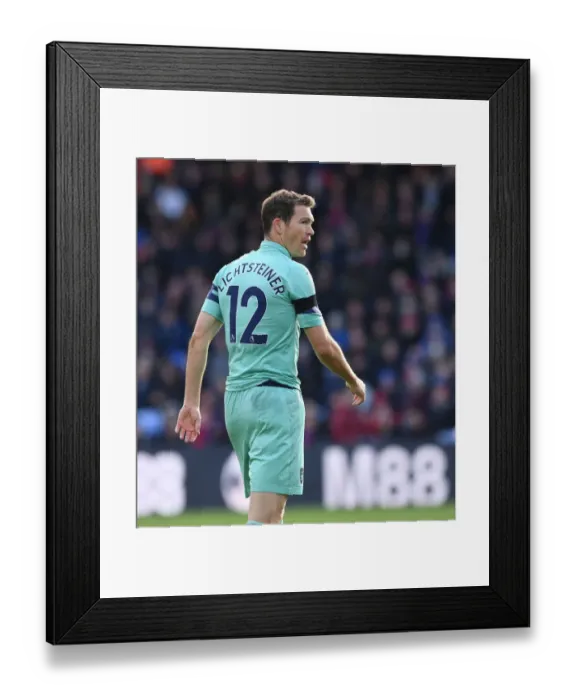 Framed Print : Intense Battle: Lichtsteiner vs Wan-Bissaka in the Premier League Clash between Crystal Palace and Arsenal, 2018-19