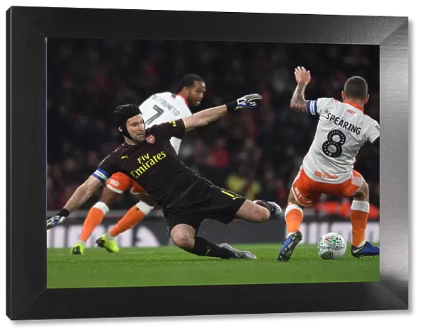 Arsenal's Petr Cech Clashes with Blackpool's Jay Spearing in Carabao Cup Showdown