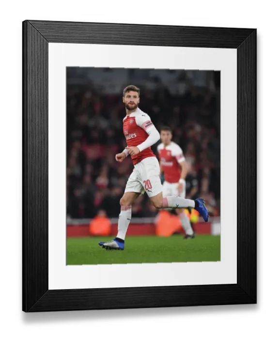 Framed Print : Shkodran Mustafi: Arsenal's Defensive Wall in Carabao Cup Clash Against Blackpool Framed Print : Shkodran Mustafi: Arsenal's Defensive Wall in Carabao Cup Clash Against Blackpool