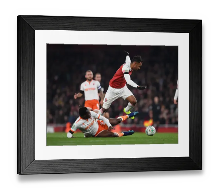 Framed Print : Arsenal's Aubameyang Faces Off Against Blackpool's Bola in Carabao Cup Clash Framed Print : Arsenal's Aubameyang Faces Off Against Blackpool's Bola in Carabao Cup Clash