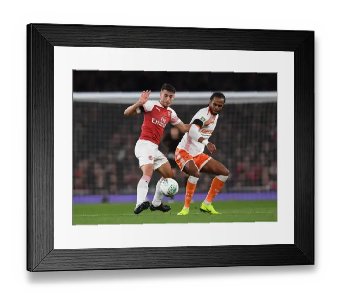 Framed Print : Arsenal vs. Blackpool: Intense Clash between Julio Pleguezuelo and Nathan Delfouneso in Carabao Cup