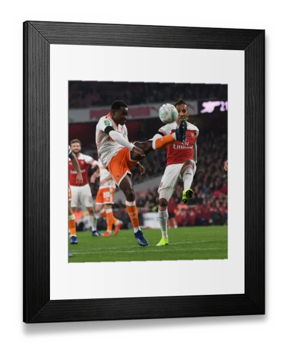 Framed Print : Aubameyang vs Bola: Intense Battle at Emirates Stadium - Arsenal vs Blackpool, Carabao Cup 2018-19