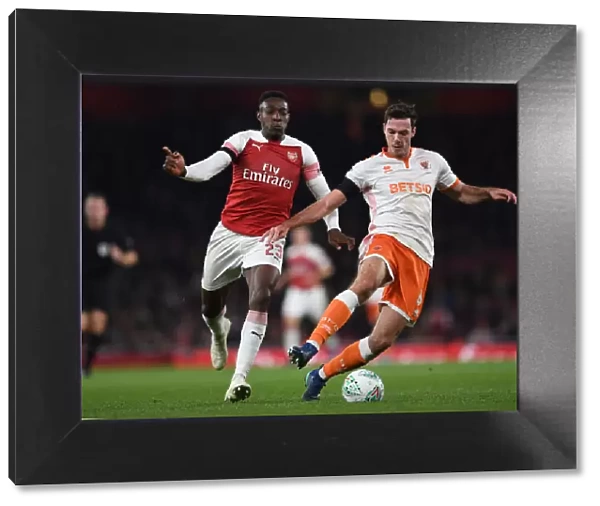 Arsenal's Danny Welbeck Closes In on Blackpool's Ben Heneghan in Carabao Cup Showdown