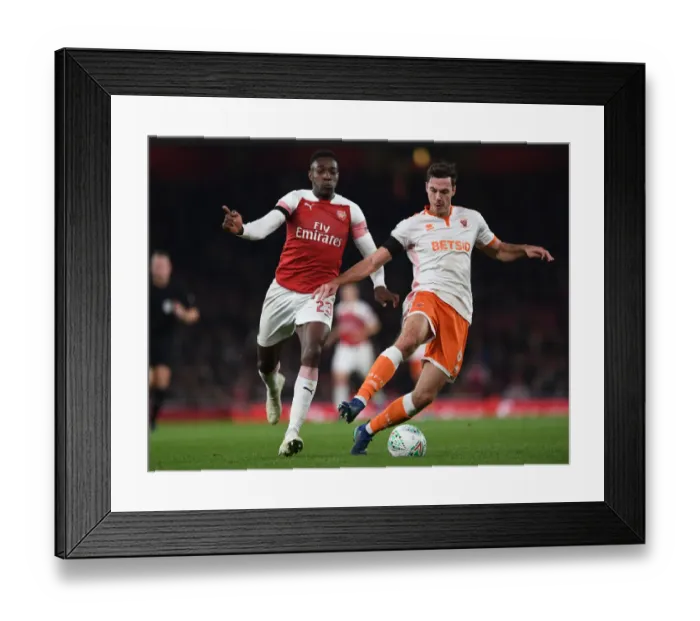 Framed Print : Arsenal's Danny Welbeck Closes In on Blackpool's Ben Heneghan in Carabao Cup Showdown