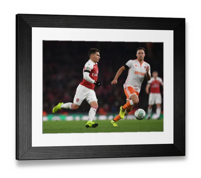 Framed Print : Torreira vs. O'Sullivan: Arsenal's Midfield Showdown in Carabao Cup Battle Against Blackpool