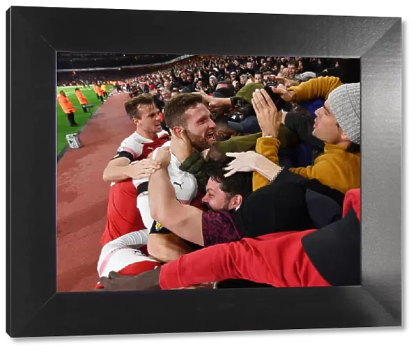 Arsenal Celebrate Goal Against Liverpool: Holding, Mustafi, and Ecstatic Fans