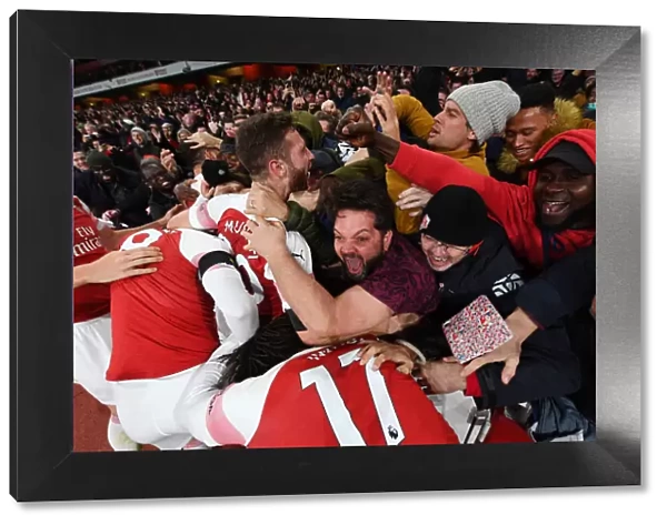Mustafi's Goal: Arsenal Fans Celebrate against Liverpool in the Premier League