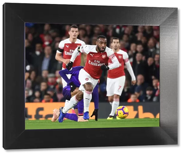 Arsenal's Alex Lacazette Outmaneuvers Liverpool's Fabinho in Premier League Clash