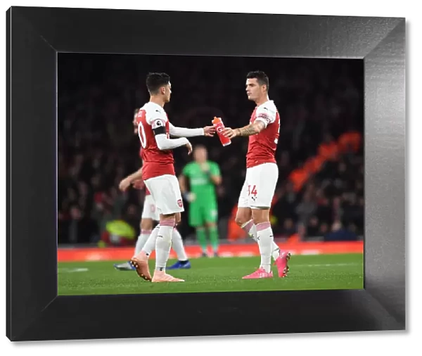 Arsenal's Ozil and Xhaka: A Midfield Duo in Action against Liverpool (2018-19)