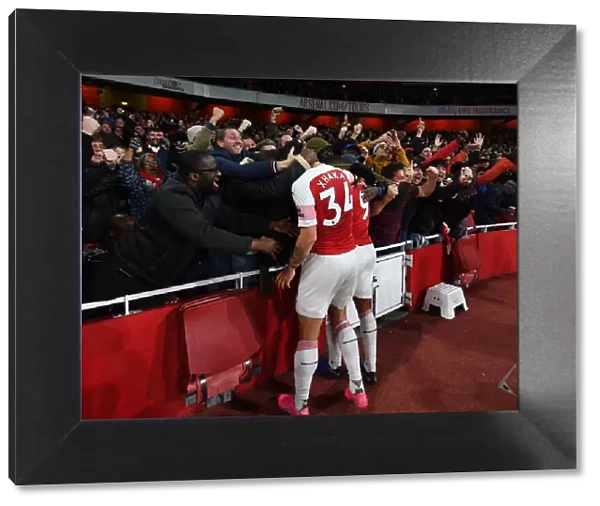 Arsenal's Lacazette and Xhaka Celebrate Goal Amidst Ecstatic Fans (Arsenal vs Liverpool, 2018-19)