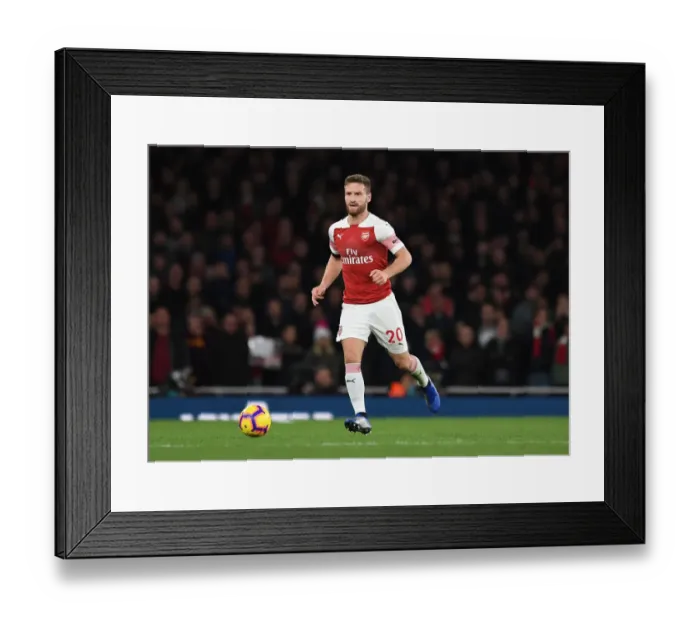 Framed Print : Shkodran Mustafi Focuses Against Liverpool in Arsenal's Premier League Battle