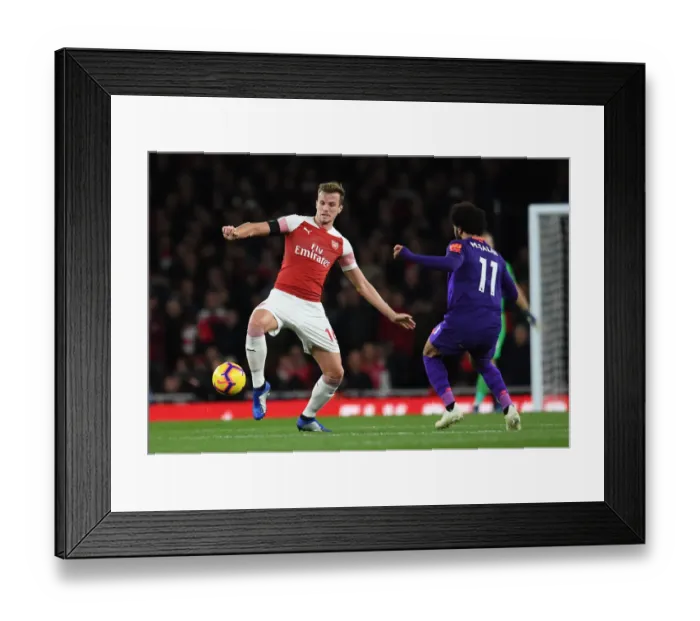 Framed Print : Mohamed Salah Closes In on Rob Holding: Intense Battle at Arsenal's Emirates Stadium Framed Print : Mohamed Salah Closes In on Rob Holding: Intense Battle at Arsenal's Emirates Stadium