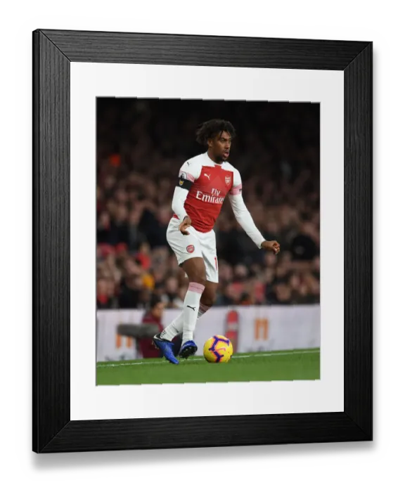 Framed Print : Arsenal's Alex Iwobi in Action Against Liverpool in the Premier League