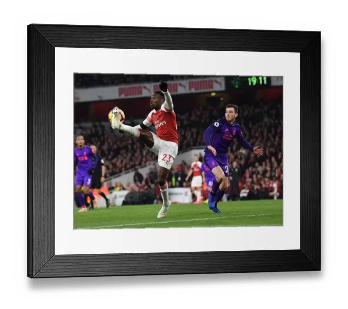 Framed Print : Arsenal's Danny Welbeck Faces Off Against Liverpool's Andrew Robertson in Premier League Showdown