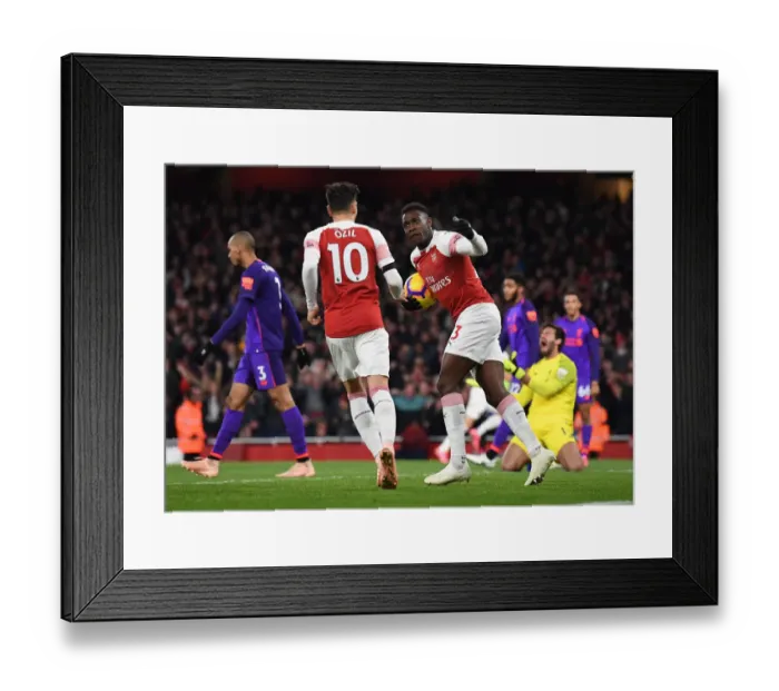 Framed Print : Arsenal's Winning Moment: Welbeck and Ozil Celebrate Goal vs. Liverpool (2018-19)
