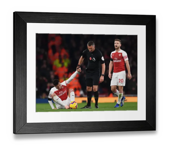 Framed Print : Mesut Ozil in Distress: Referee Andre Marriner Steps In During Arsenal vs. Liverpool Clash (2018-19)