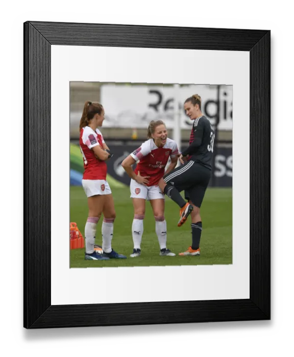 Framed Print : Arsenal Women vs. Birmingham Ladies: A Light-Hearted Moment Between Teammates Lia Walti, Tabea Kemme, and Ann-Katrin Berger