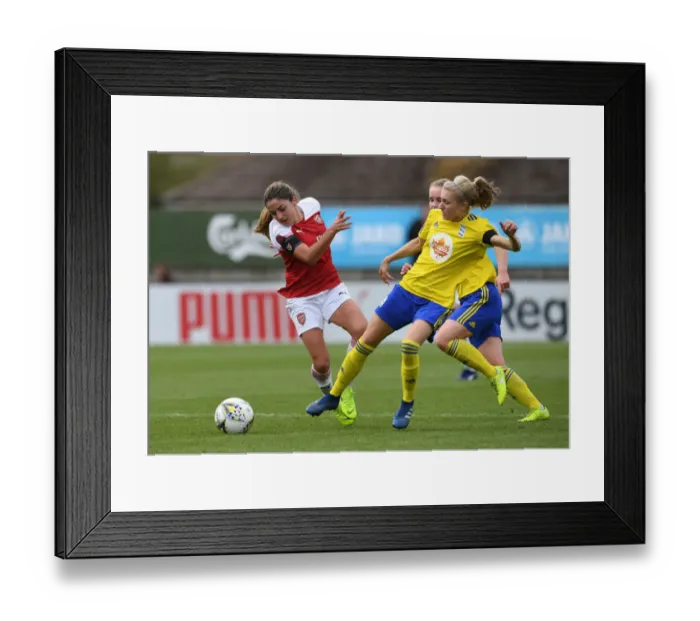 Framed Print : Determination Clash: Van de Donk vs. Folils - A Battle of Wills in Arsenal Women's Football