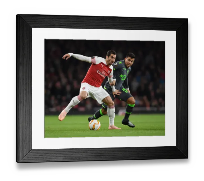 Framed Print : Henrikh Mkhitaryan Faces Off Against Marcos Acuna in Arsenal vs. Sporting CP UEFA Europa League Clash