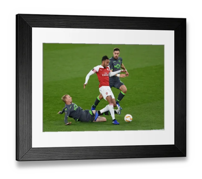 Framed Print : Aubameyang vs Mathieu: Intense Moment in Arsenal's Europa League Clash with Sporting CP