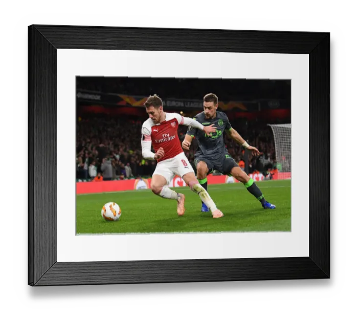 Framed Print : Clash of Champions: Ramsey vs. Coates in Arsenal's Europa League Battle Framed Print : Clash of Champions: Ramsey vs. Coates in Arsenal's Europa League Battle