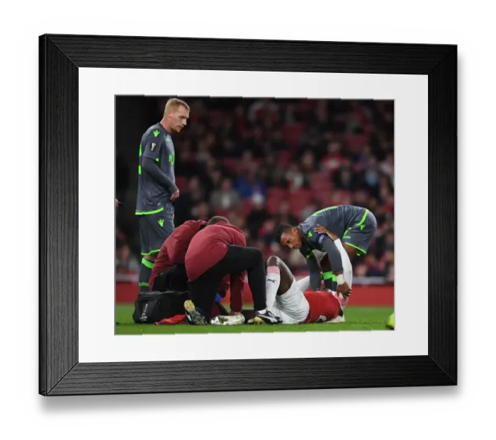Framed Print : Danny Welbeck Consoled by Nani Amid Injury: Arsenal vs. Sporting CP, UEFA Europa League 2018-19