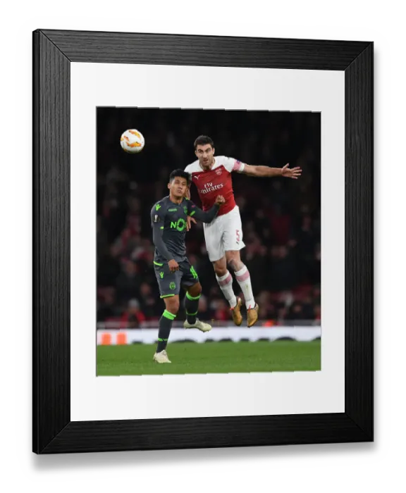 Framed Print : Sokratis vs Montero: A Head-to-Head Battle in Arsenal's Europa League Clash with Sporting CP Framed Print : Sokratis vs Montero: A Head-to-Head Battle in Arsenal's Europa League Clash with Sporting CP
