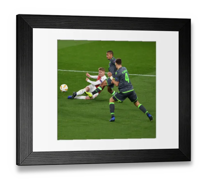 Framed Print : Emile Smith Rowe Faces Off Against Bruno Gasper and Sebastian Coates in Arsenal's Europa League Clash with Sporting CP Framed Print : Emile Smith Rowe Faces Off Against Bruno Gasper and Sebastian Coates in Arsenal's Europa League Clash with Sporting CP