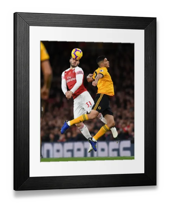 Framed Print : Clash of Titans: Sead Kolasinac vs. Raul Jimenez - Arsenal vs. Wolverhampton Wanderers, Premier League 2018-19 Framed Print : Clash of Titans: Sead Kolasinac vs. Raul Jimenez - Arsenal vs. Wolverhampton Wanderers, Premier League 2018-19