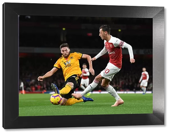 Mesut Ozil vs. Matt Doherty: Intense Clash Between Arsenal's Ozil and Wolverhampton's Doherty in Premier League Match