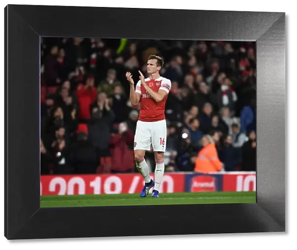 Rob Holding Celebrates with Fans: Arsenal vs. Wolverhampton Wanderers, Premier League 2018-19