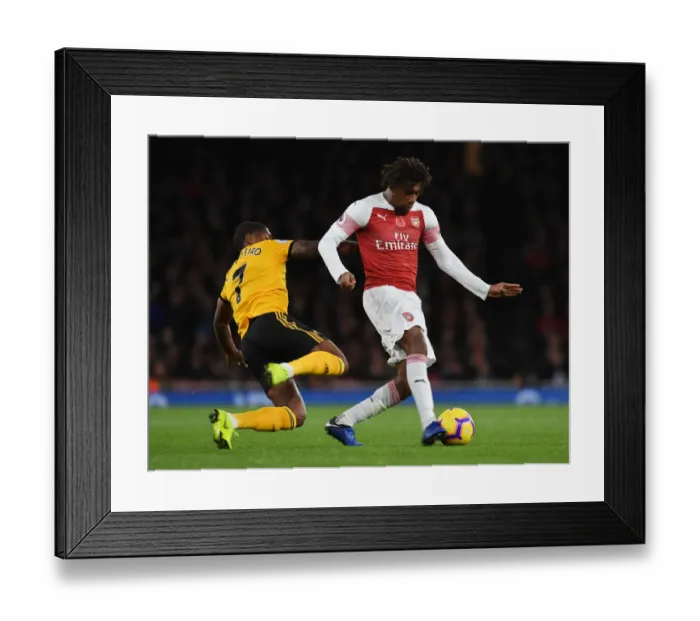 Framed Print : Alex Iwobi Outsmarts Ivan Cavaleiro: A Premier League Battle at Emirates Stadium Framed Print : Alex Iwobi Outsmarts Ivan Cavaleiro: A Premier League Battle at Emirates Stadium